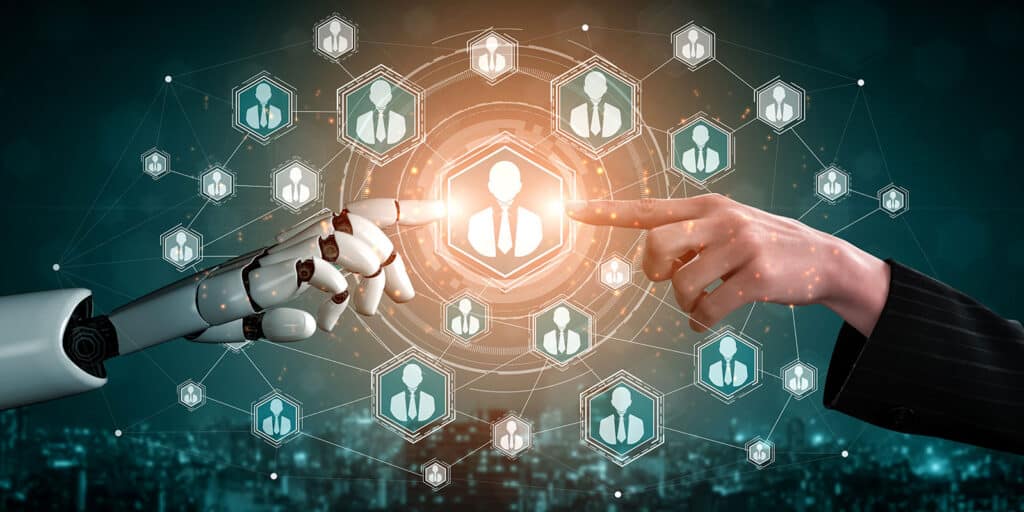 Robot and human hands reaching towards a glowing icon amid network graphics on a dark blue background, symbolizing AI collaboration.
