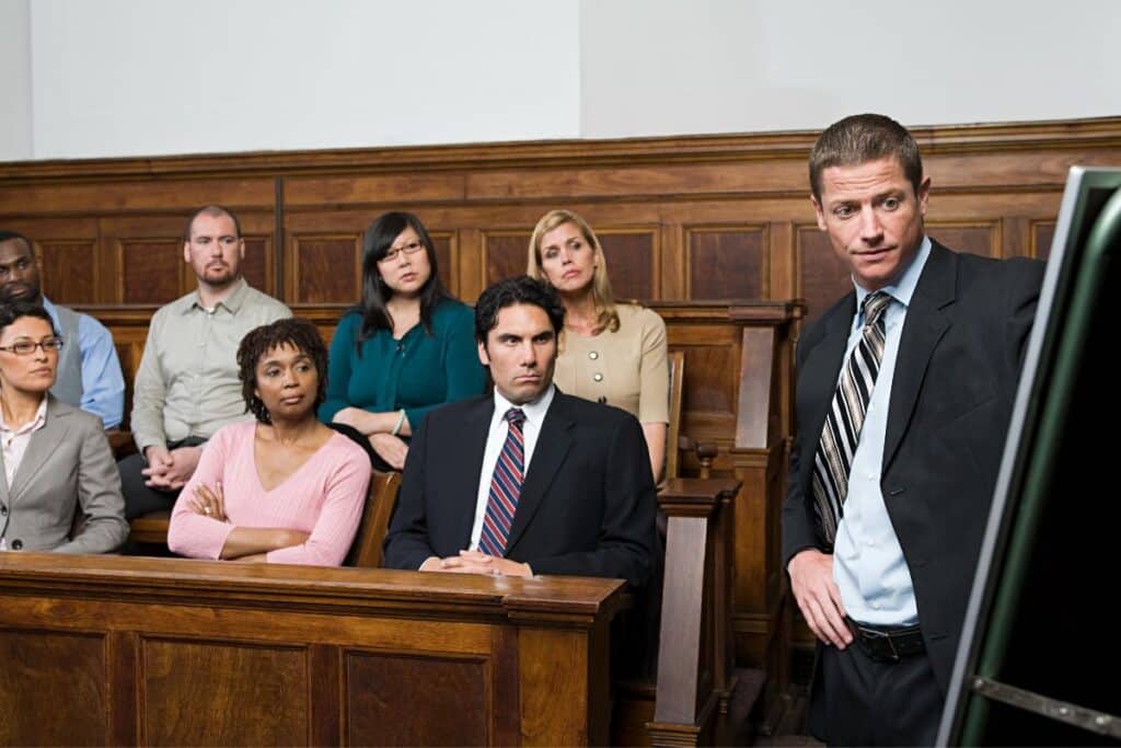 Lawyer addressing jury in courtroom
