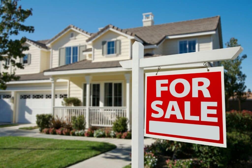Two-story house for sale sign